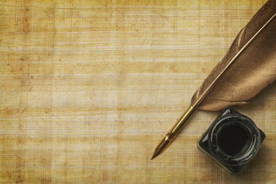 Picture of parchment with quill and ink